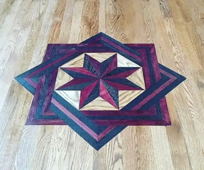 Eight-point star medallion inlaid in purpleheart and oak