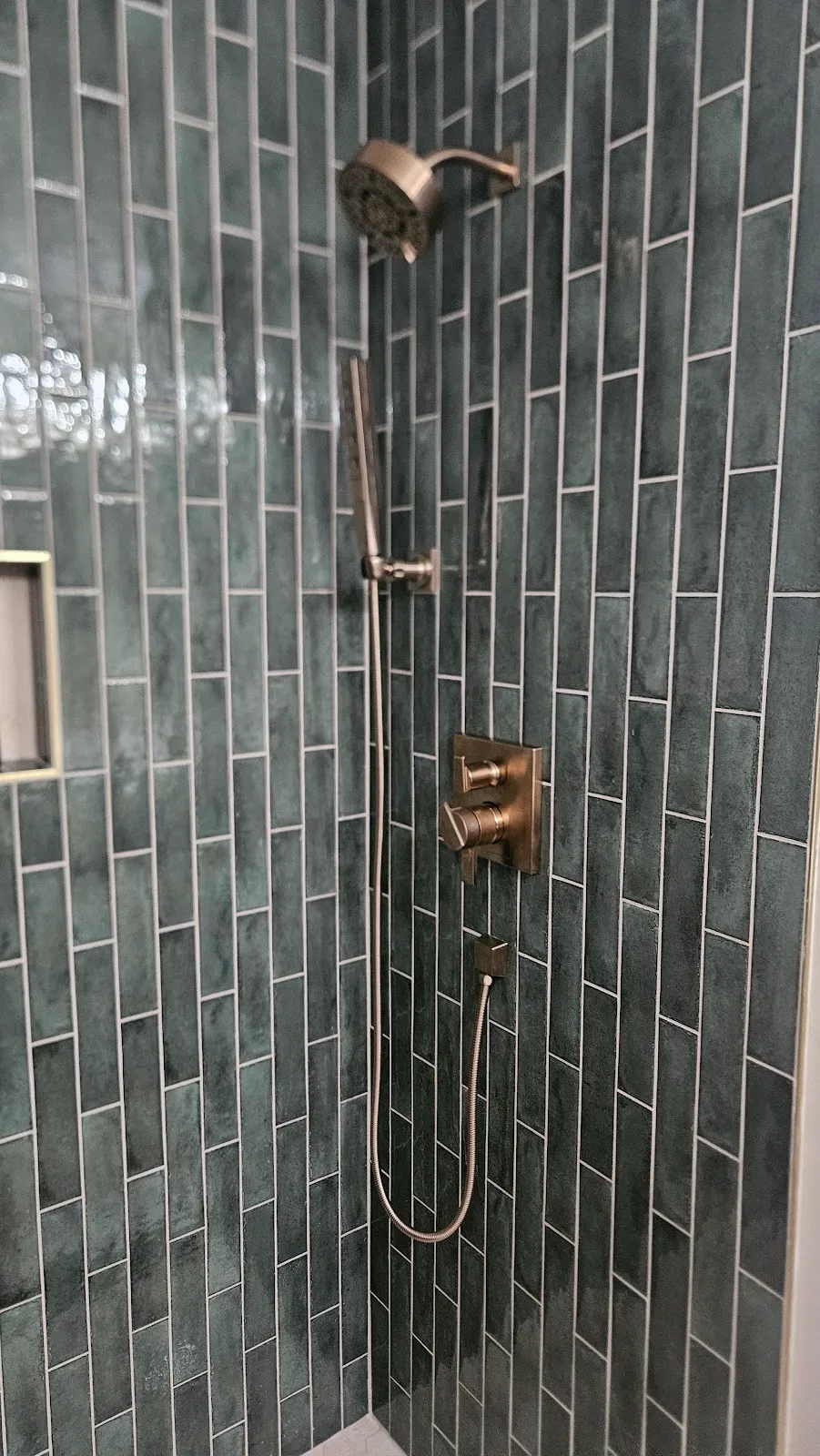 Matte green tile shower installed by Grain Design Flooring